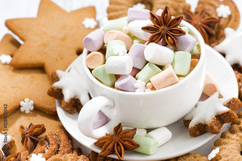 marshmallow in a cup and assortment of Christmas cookies