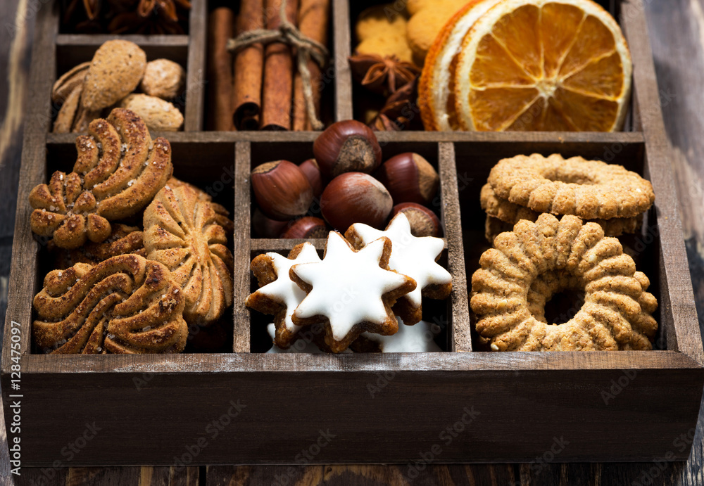 Fototapeta premium wooden box with Christmas sweets and spices on wooden table