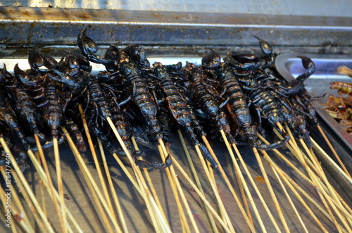 Chinese street food in the Hutongs of Beijing Wangfujing Street roasted scorpions as snack street food in China
