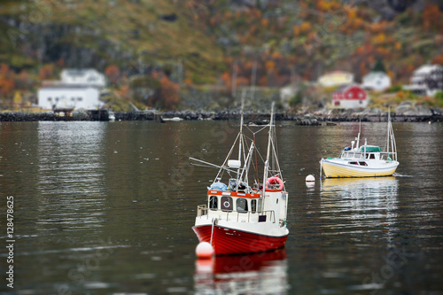 European village in miniature, fishing boats, tilt shift effect, 