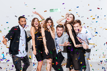 Group of happy young people celebrating and having fun together