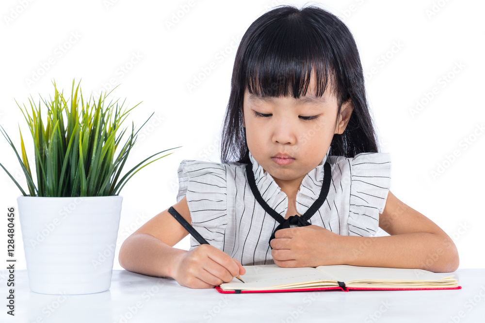Asian Chinese little office lady writing book on the desk Asian Chinese little office lady writing book on the desk