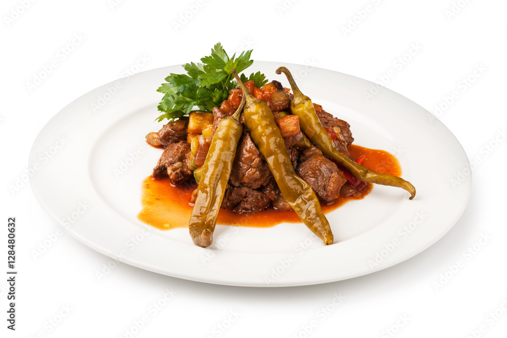 pieces of meat cooked with onion, tomato and pepper pieces of meat cooked with onion, tomato and pepper