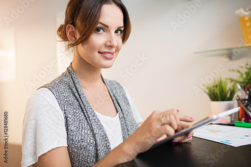 Beautiful woman at home using tablet