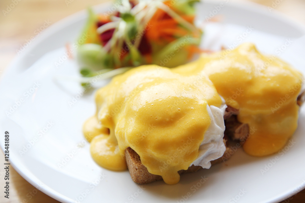 egg benedict on wood background egg benedict on wood background