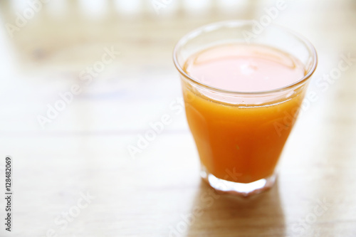 Orange juice on wood background