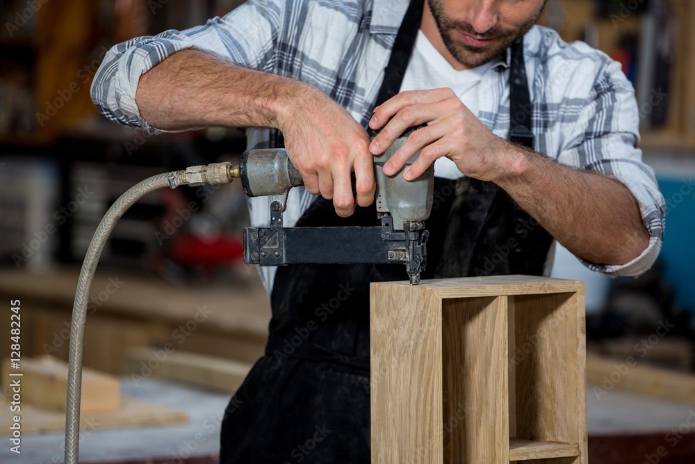 Carpenter working on his craft Carpenter working on his craft