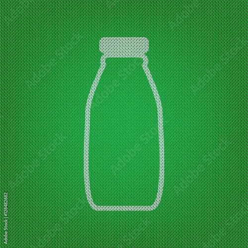 Milk bottle sign. white icon on the green knitwear or woolen clo