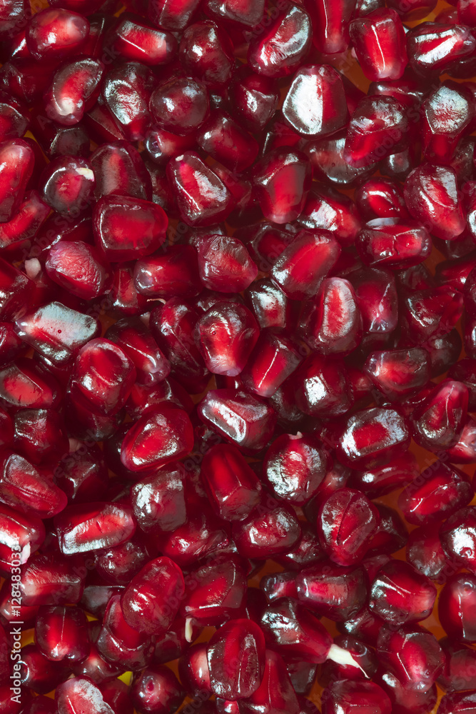 refined grains of red pomegranate background refined grains of red pomegranate background