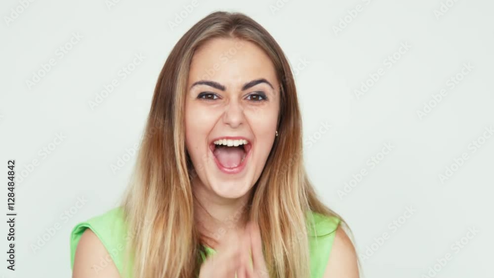 Surprise and joy. Portrait cheerful girl 18 years old teenager looking at camera on white background Surprise and joy. Portrait cheerful girl 18 years old teenager looking at camera on white background