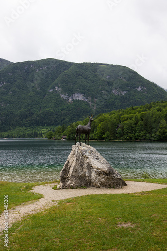 Goldenhorn statue on Bohinj lake, Slovenia photo