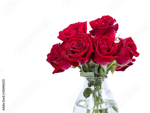 Bouquet red roses flower in glass bottle on isolated background