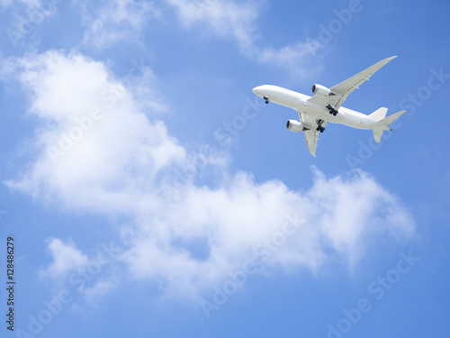 Airplane flying under blue sky 5 © npstockphoto