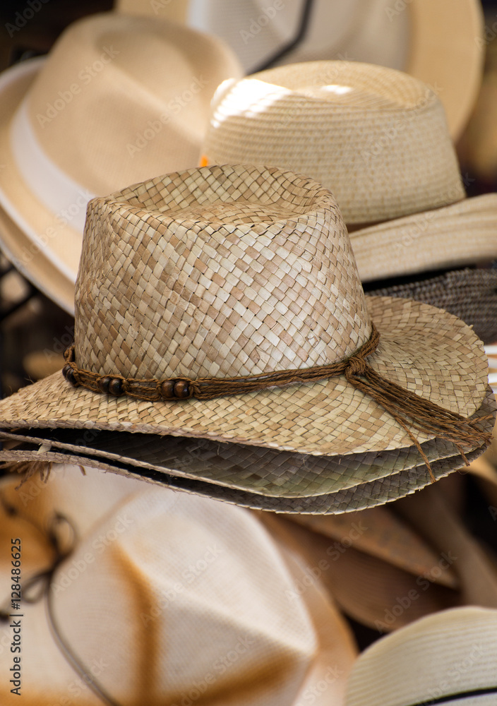 Straw hats for sale in the market.