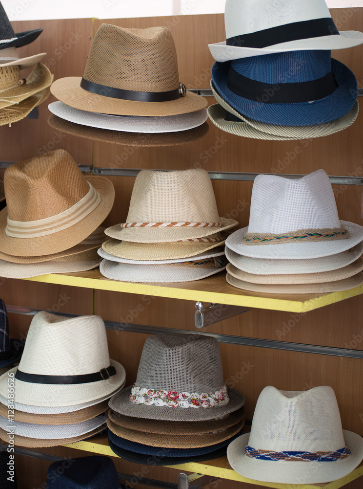 Variety of hats for sale in the market.