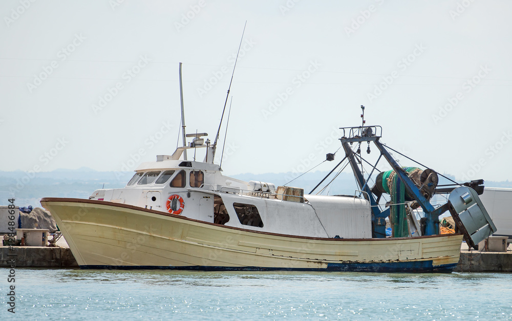 Naklejka premium Fishing vessel in the port.