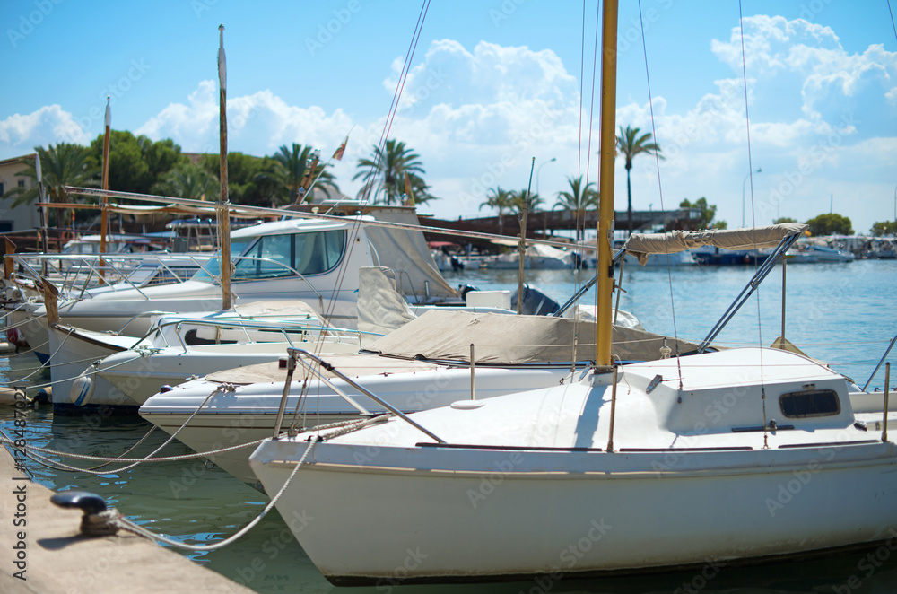 Fototapeta premium Many luxury boats and yachts in the harbor.