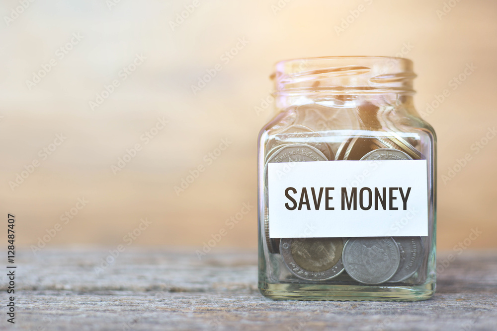 Money in a glass jar with Money in a glass jar with