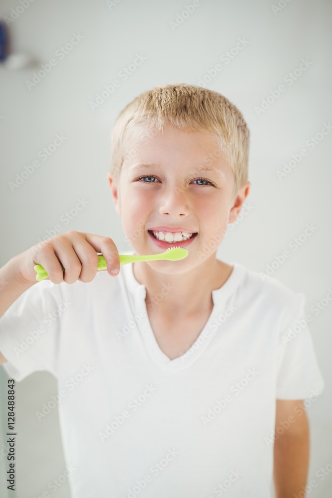 Portrait of boy smiling while brushing teeth Portrait of boy smiling while brushing teeth