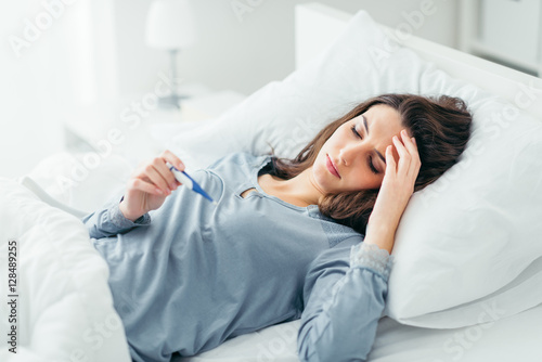 Photos Woman measuring her temperature