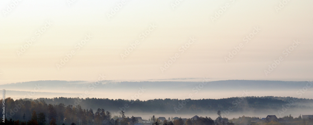  delicate haze of morning mist over the valley. hilly landscape. Savannah, grassland . used toning of the photo