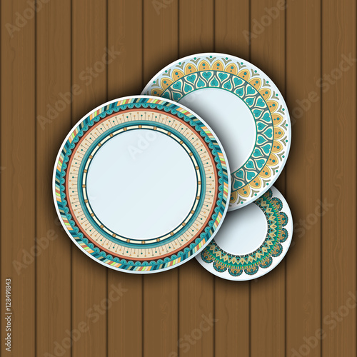 Set of decorative plates with a ethnic tribal ornament of handwork and an empty space in the center.
