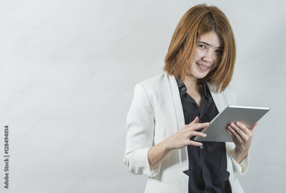 Business woman holding a tablet computer - over a white background Business woman holding a tablet computer - over a white background