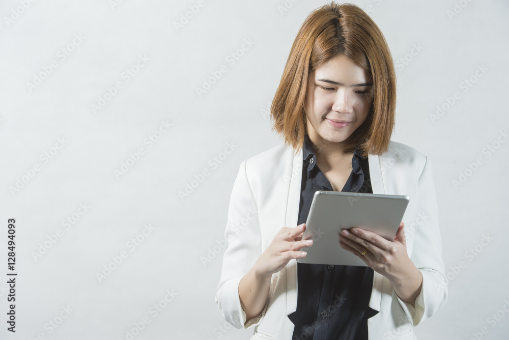 Business woman holding a tablet computer - over a white background Business woman holding a tablet computer - over a white background