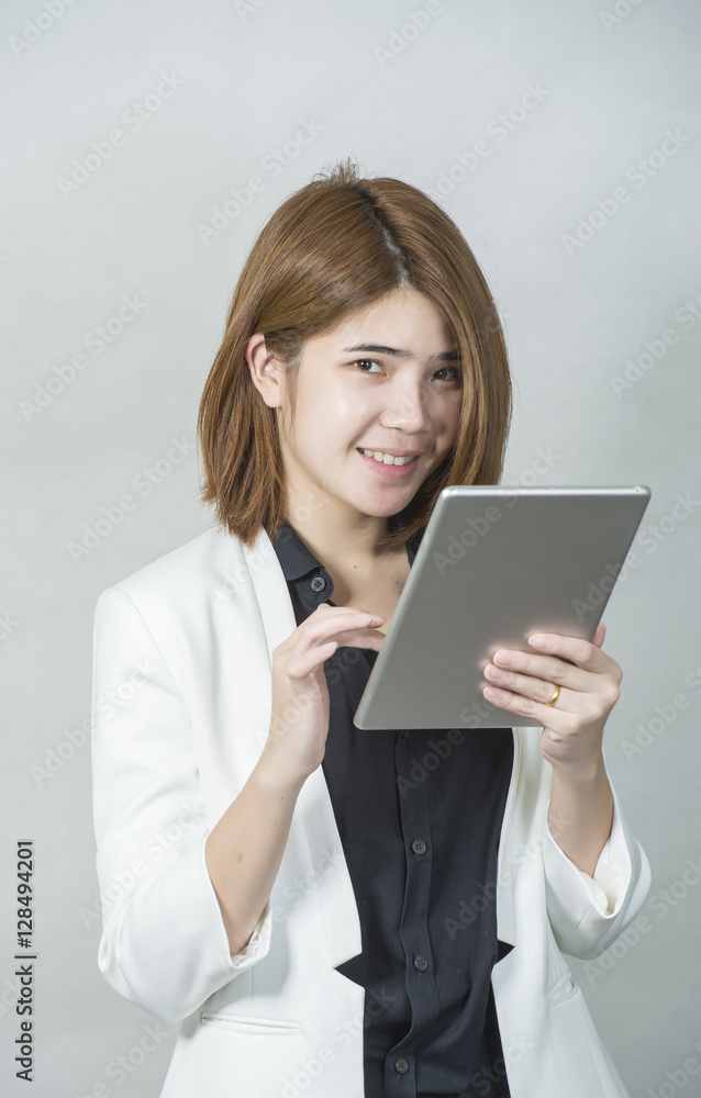 Business woman holding a tablet computer - over a white background Business woman holding a tablet computer - over a white background