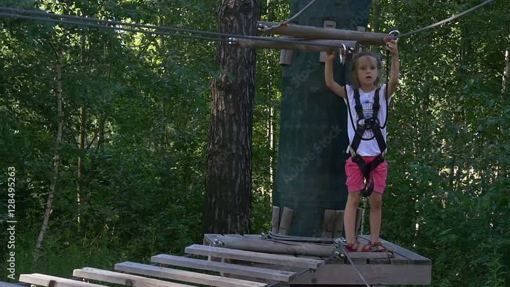 Girl Preparing For Descent to Wooden Platform Girl Preparing For Descent to Wooden Platform