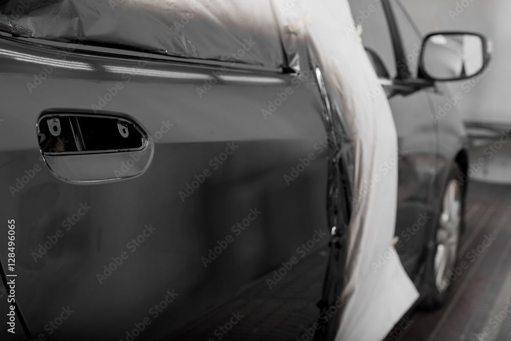 Fototapeta premium Auto body repair series : Black car after repaint in paint booth