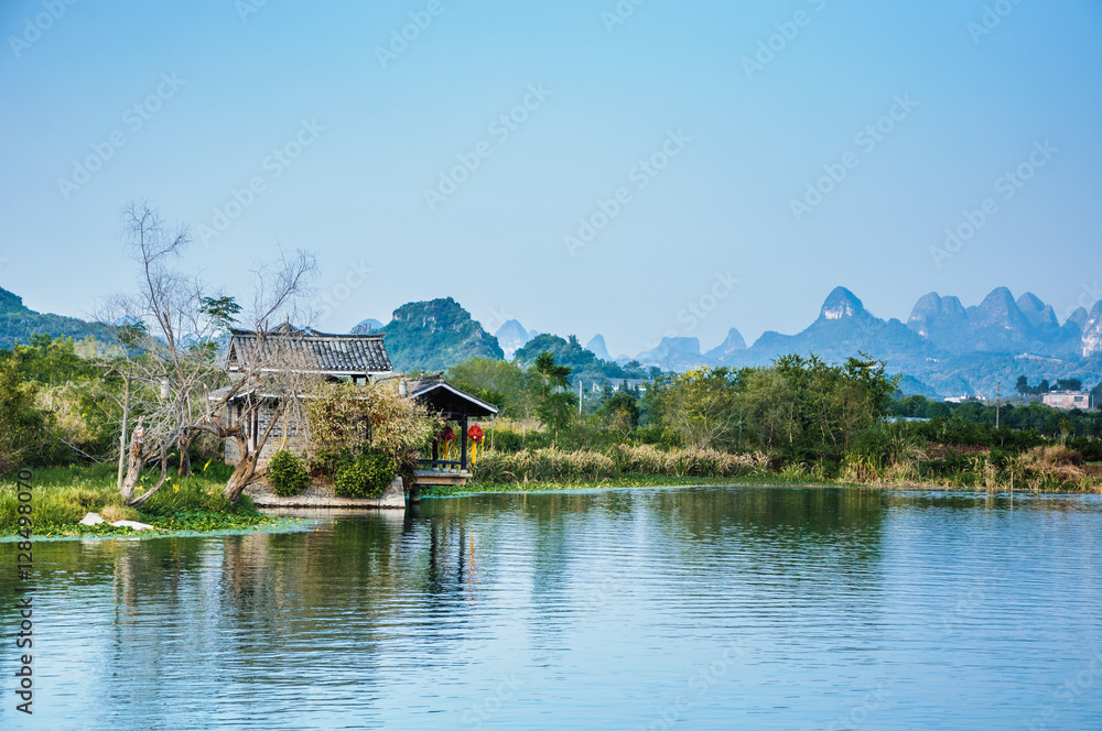 The karst mountains and river scenery in the evening The karst mountains and river scenery in the evening