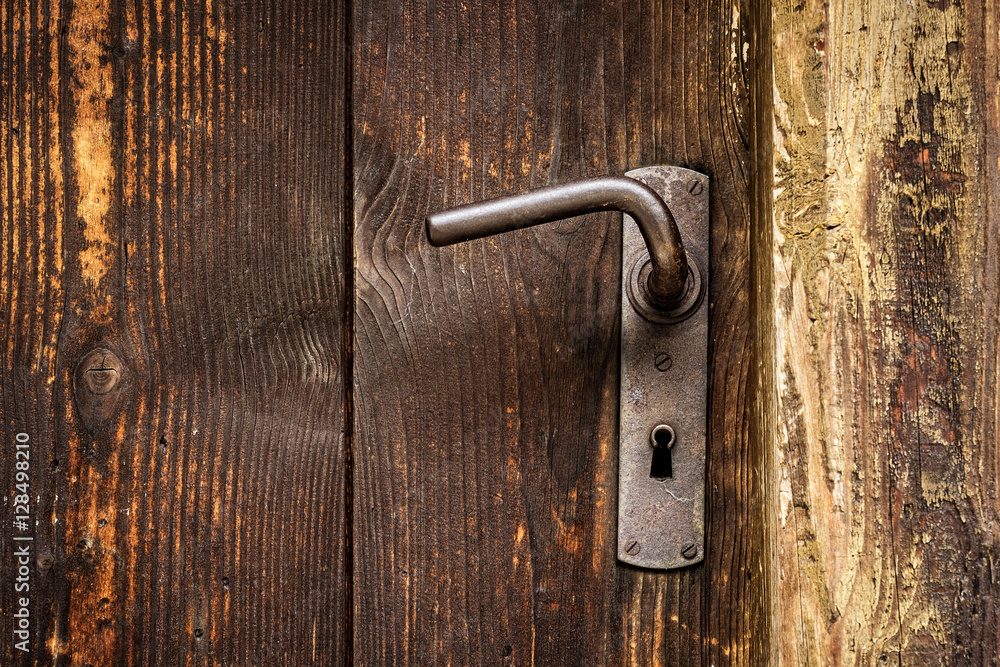 Door handle on old wooden door Door handle on old wooden door