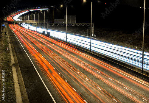 Busy British motorway M1 at night photo