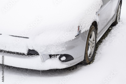 Fall asleep wet snow car. Snowfall of wet snow. Snow lying on the car photo