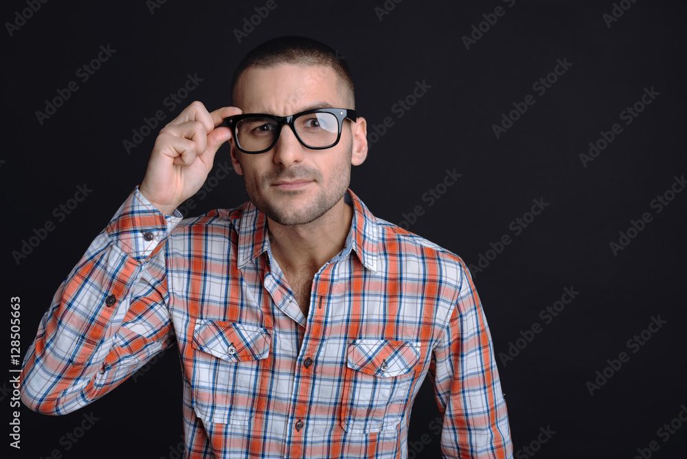 Fototapeta premium Serious man looking narrowly at camera