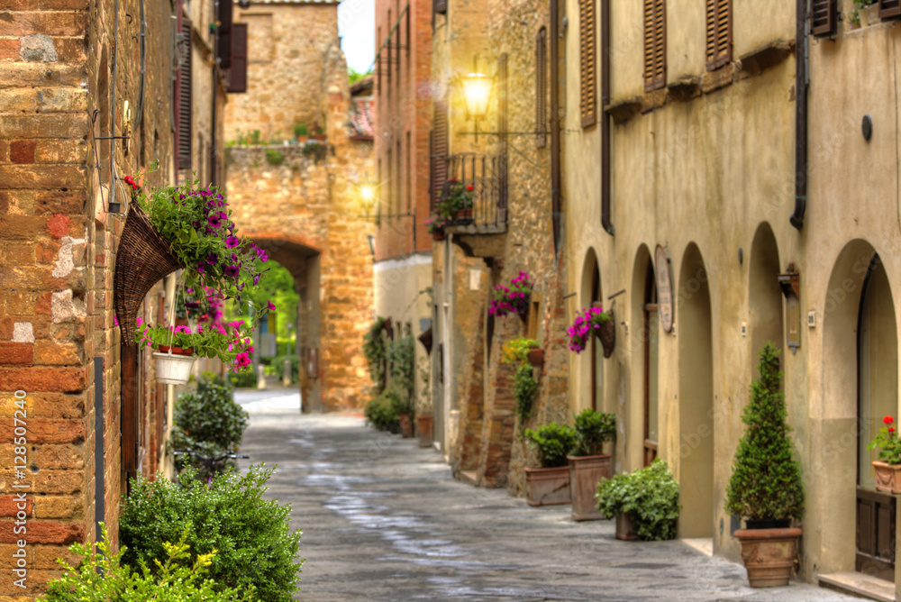 Flowery streets on a spring day in a old village Pienza.