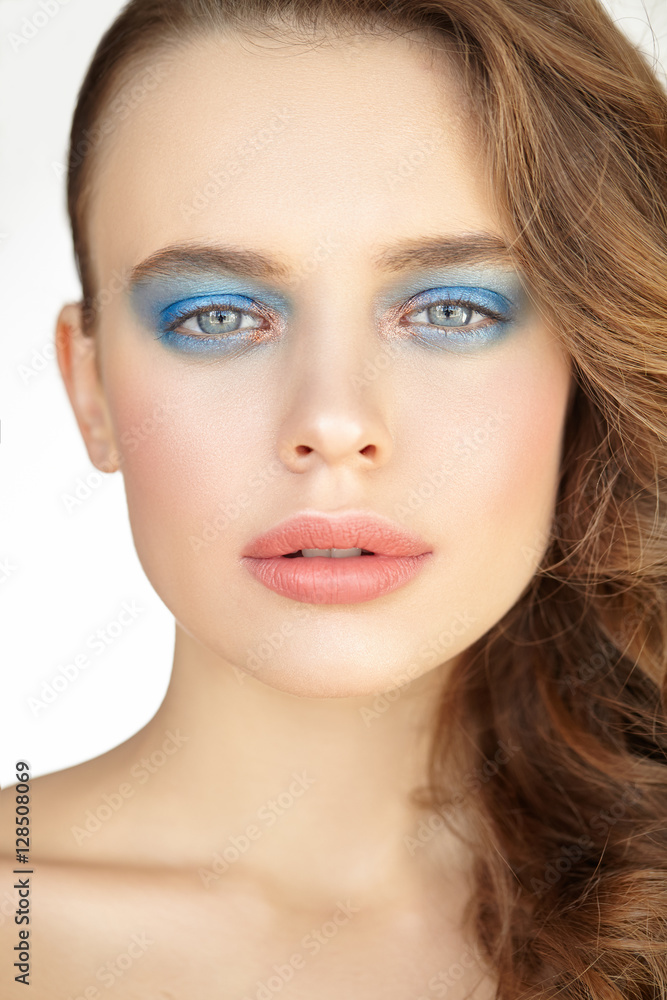 Close-up beauty portrait of girl with blue shadows