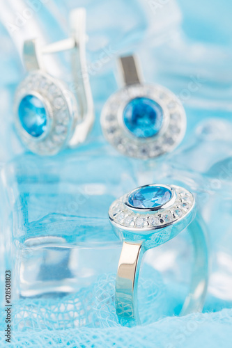 Silver ring with zircon and blue gemstone