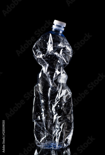 Crumpled Plastic Bottle Isolated on Black Background