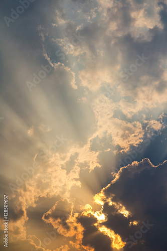 Clouds and golden sunbeam at evening