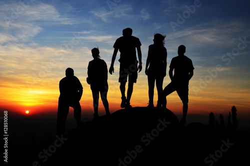 Silhouette of a of hikers group living an adventure at the top of a mountain (Morro Capivari at Campina Grande do sul Brazil) Freedom