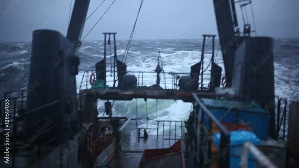 Aft part of the ship is swinging on the waves during a storm Aft part of the ship is swinging on the waves during a storm
