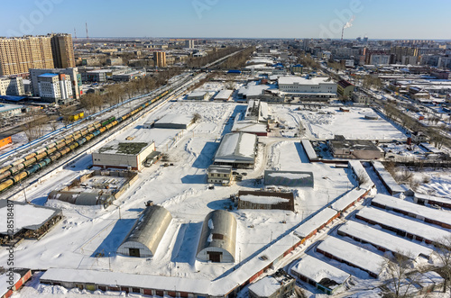 Tyumen, Russia - March 11, 2016: Former meat-processing plant and residential areas near railways