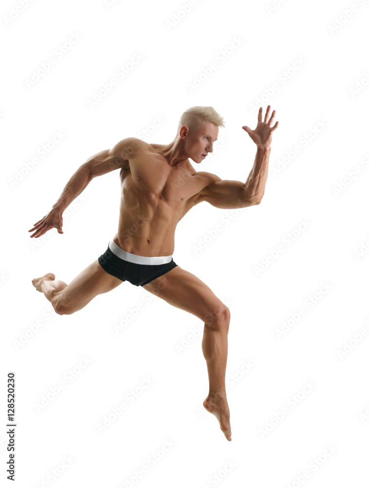Blond athlete poses during jump. Isolated on white Blond athlete poses during jump. Isolated on white