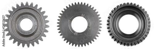 Three steel cog gears isolated over white photo