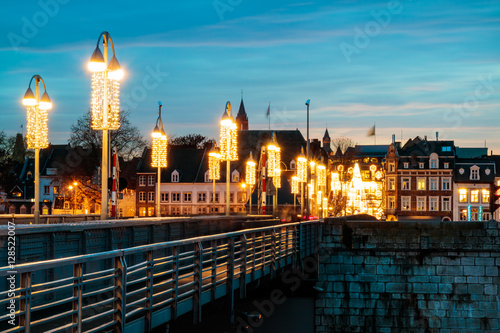 View at the Dutch Sint Servaas bridge with christmas lights in Maastricht