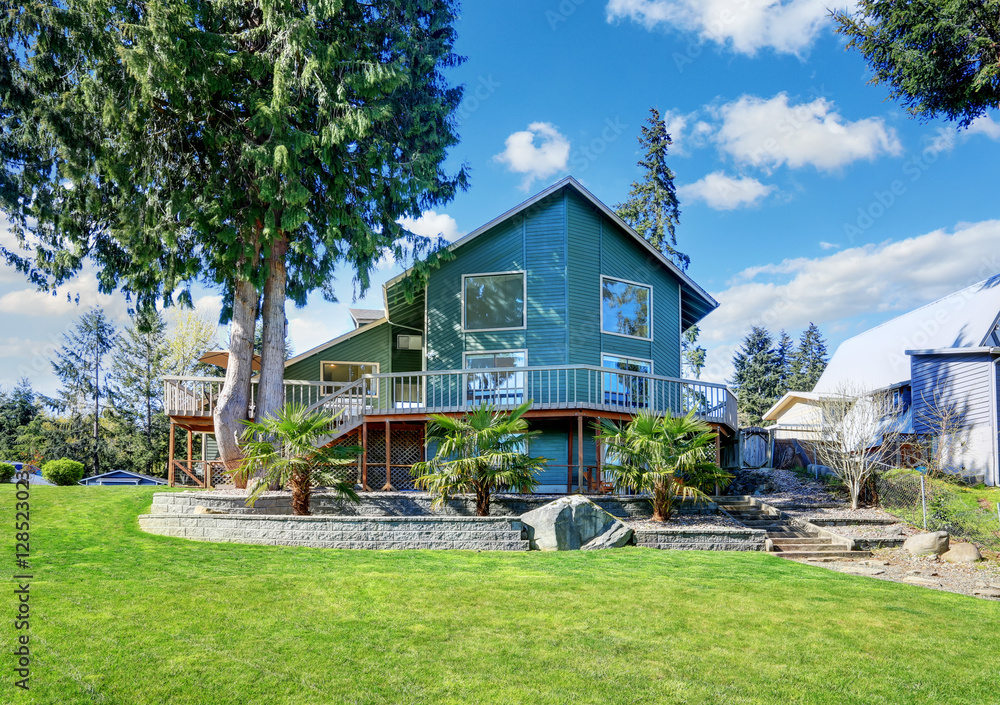 Beautiful waterfront home exterior on Lake Tapps. Beautiful waterfront home exterior on Lake Tapps.
