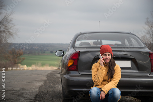 Young woman with broken car © phpetrunina14