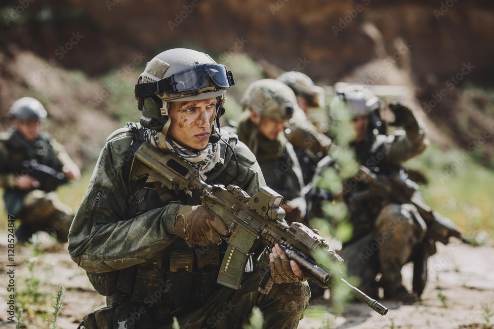 Portrait of a ranger in the battlefield with a gun Portrait of a ranger in the battlefield with a gun